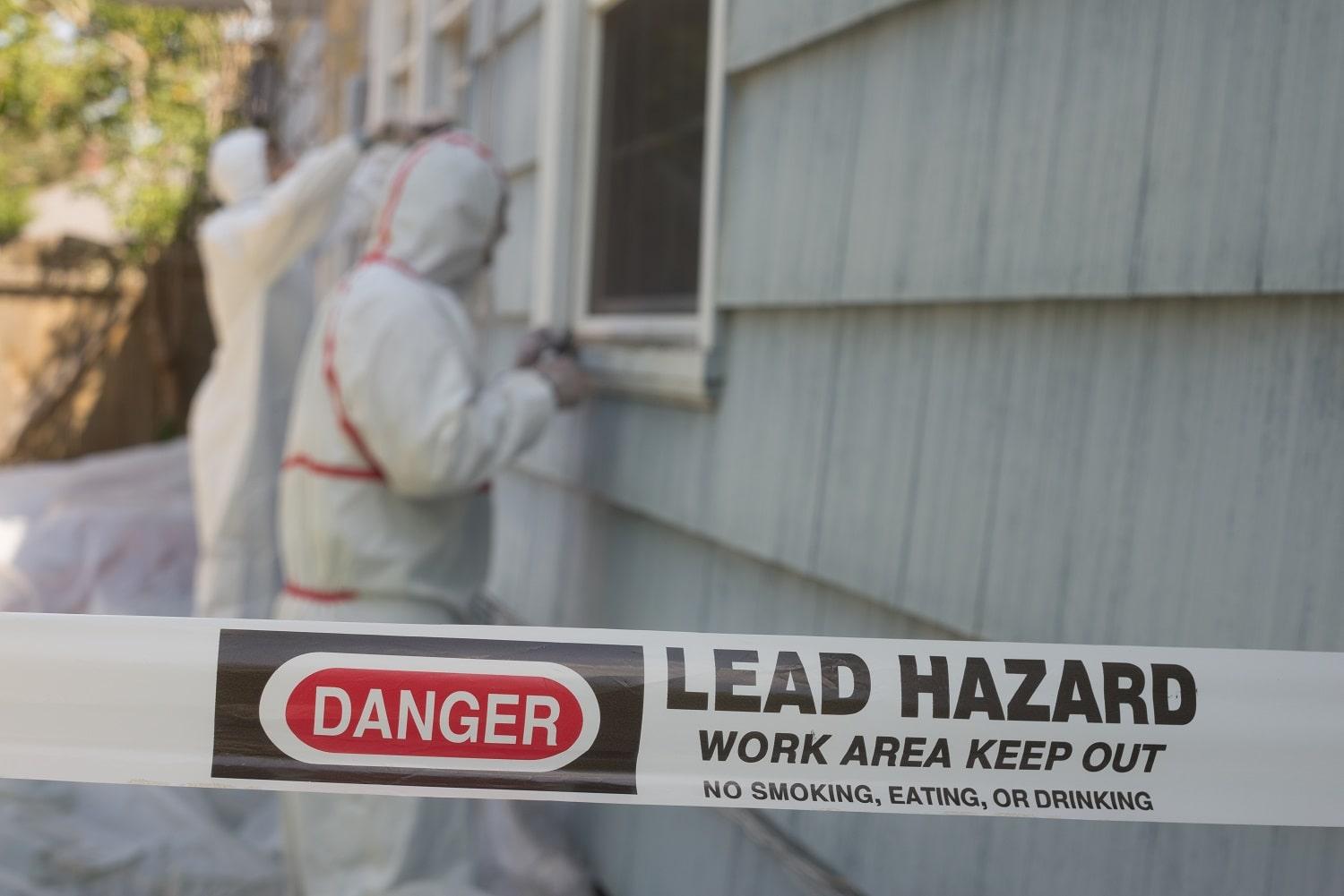 Professionals remove lead-based paint