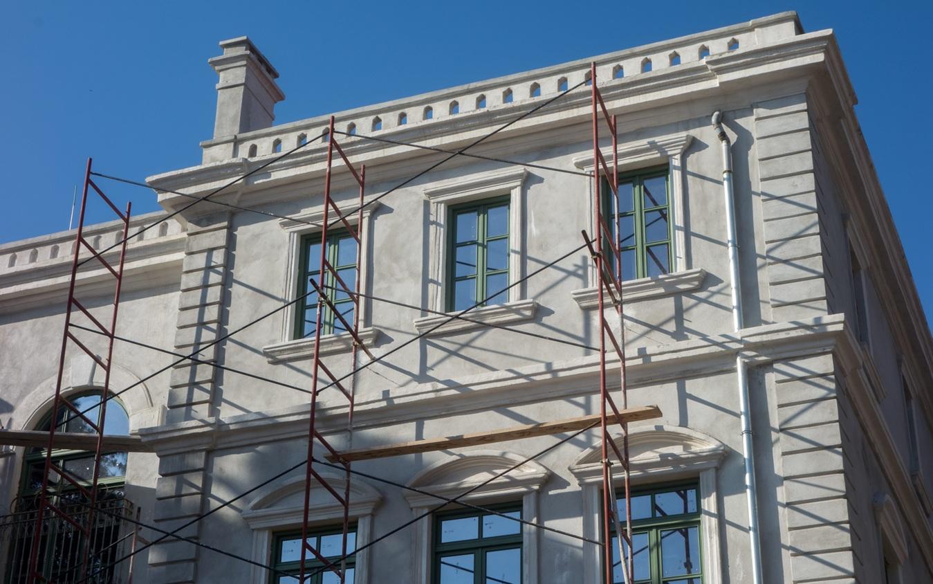 Scaffolding at a neoclassical building during restoration of an old building
