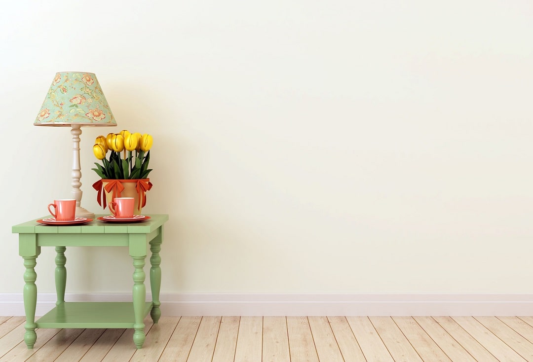 Painted wall and a table with flower - Priority One Coatings