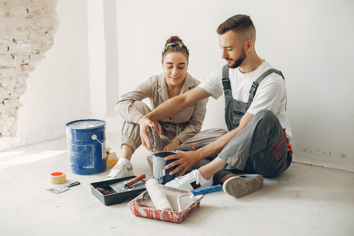 young couple repairs room