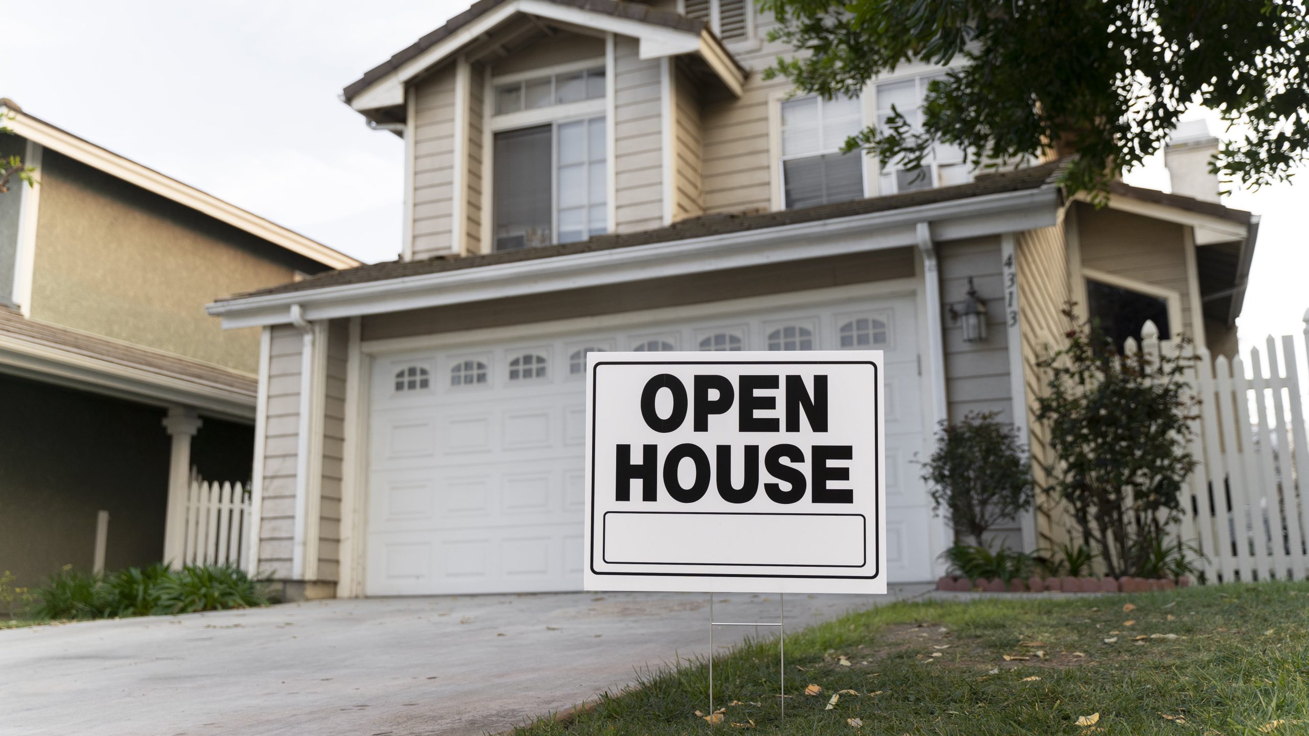 house with yard sign open house