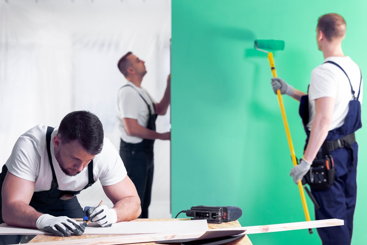 renovation crew painting in a room