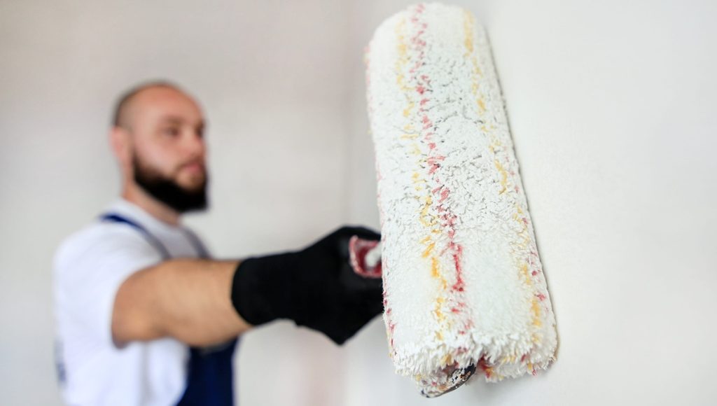 construction worker doing finish renovation at apartment