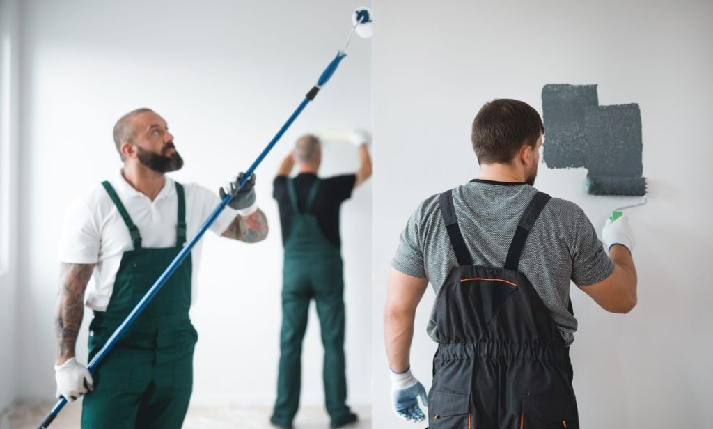 professional renovation crew painting walls of new build apartment